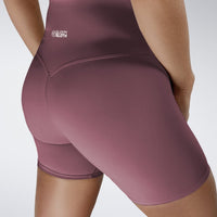 Shorts in burgundy on model - Surge Collection activewear
