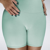 Shorts in mint green on model - Surge Collection activewear