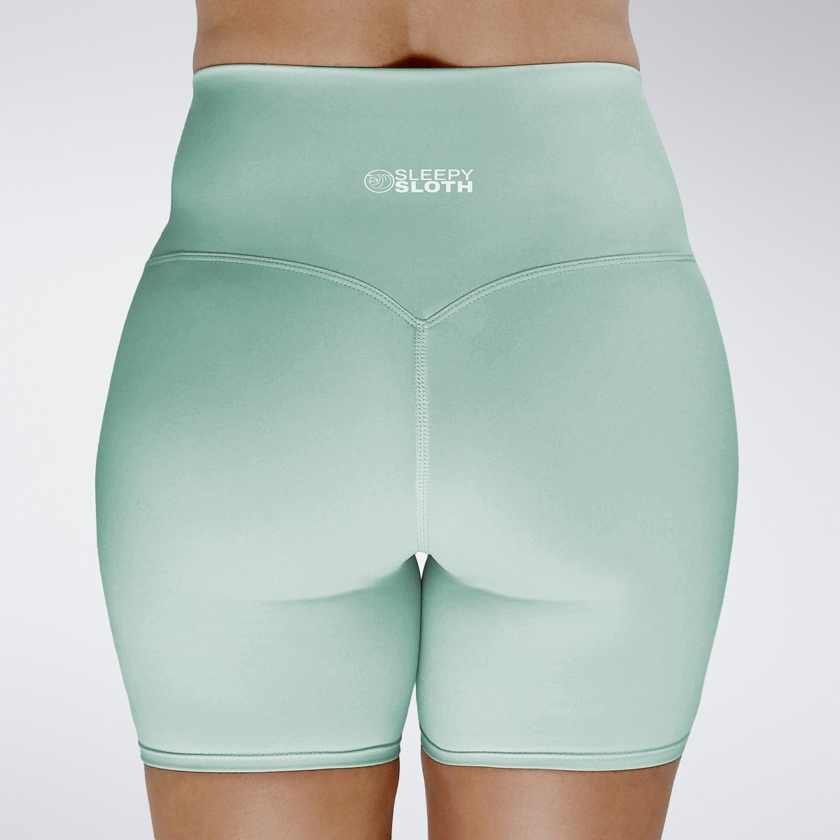 Shorts in mint green on model - Surge Collection activewear