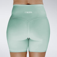 Shorts in mint green on model - Surge Collection activewear