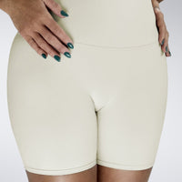 Shorts in ivory cream on model - Surge Collection activewear