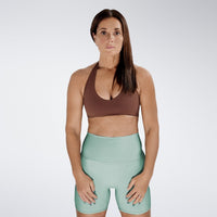 Shorts in mint green on model - Surge Collection activewear
