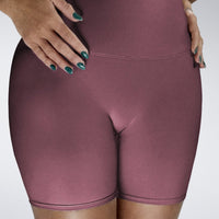 Shorts in burgundy on model - Surge Collection activewear