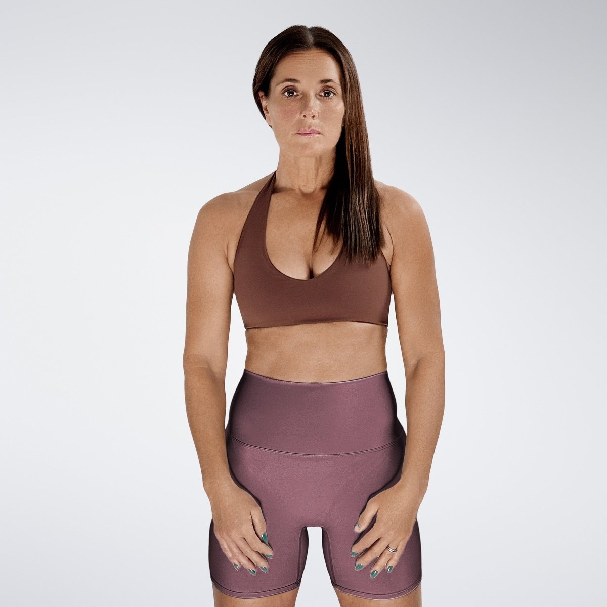 Shorts in burgundy on model - Surge Collection activewear