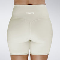 Shorts in ivory cream on model - Surge Collection activewear