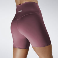 Shorts in burgundy on model - Surge Collection activewear