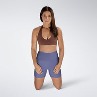 Shorts in purple on model - Surge Collection activewear